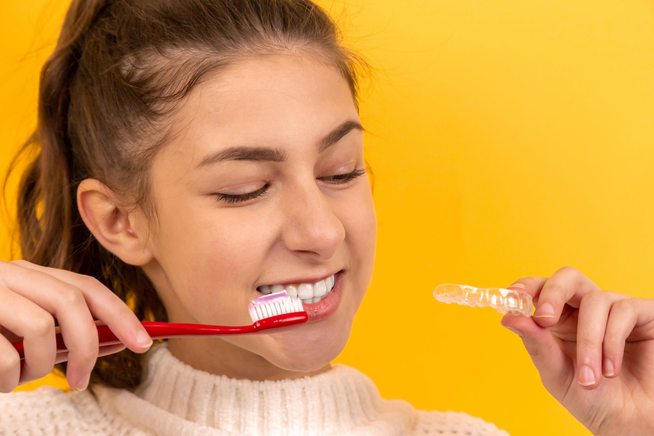 A woman brushing her teeth