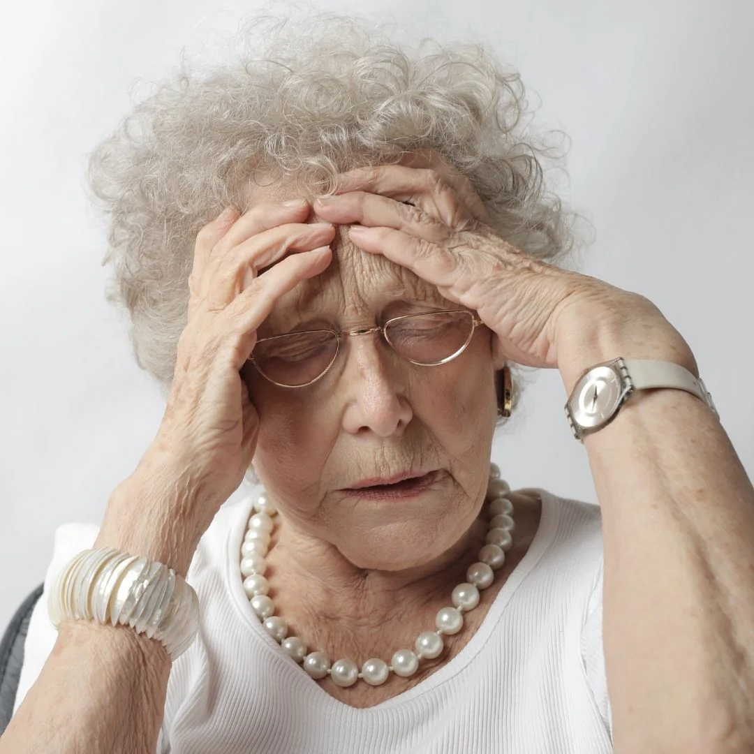 woman with hands on head