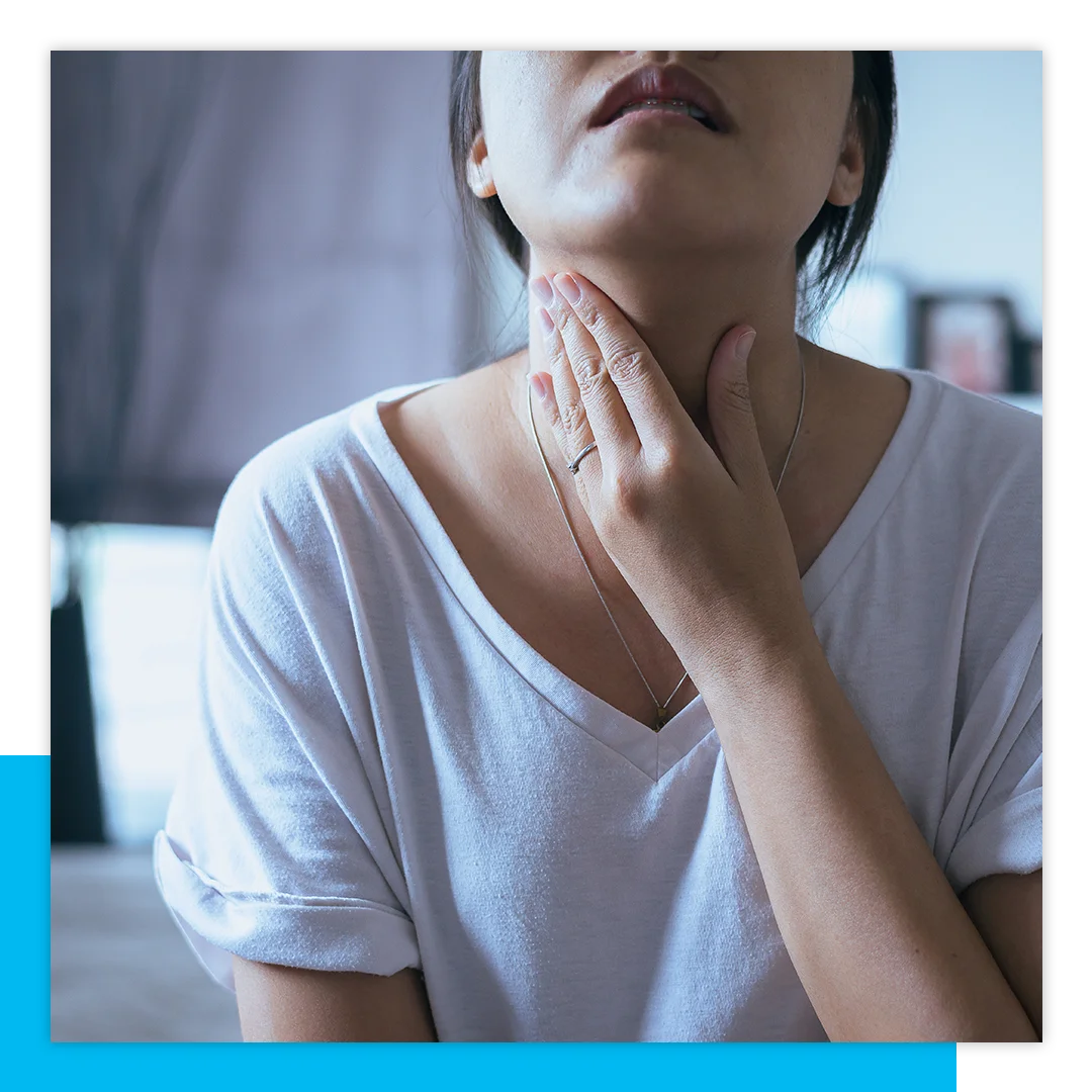 woman with throat pain