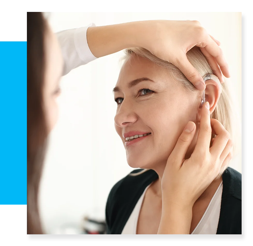 Woman recieving hearing aide