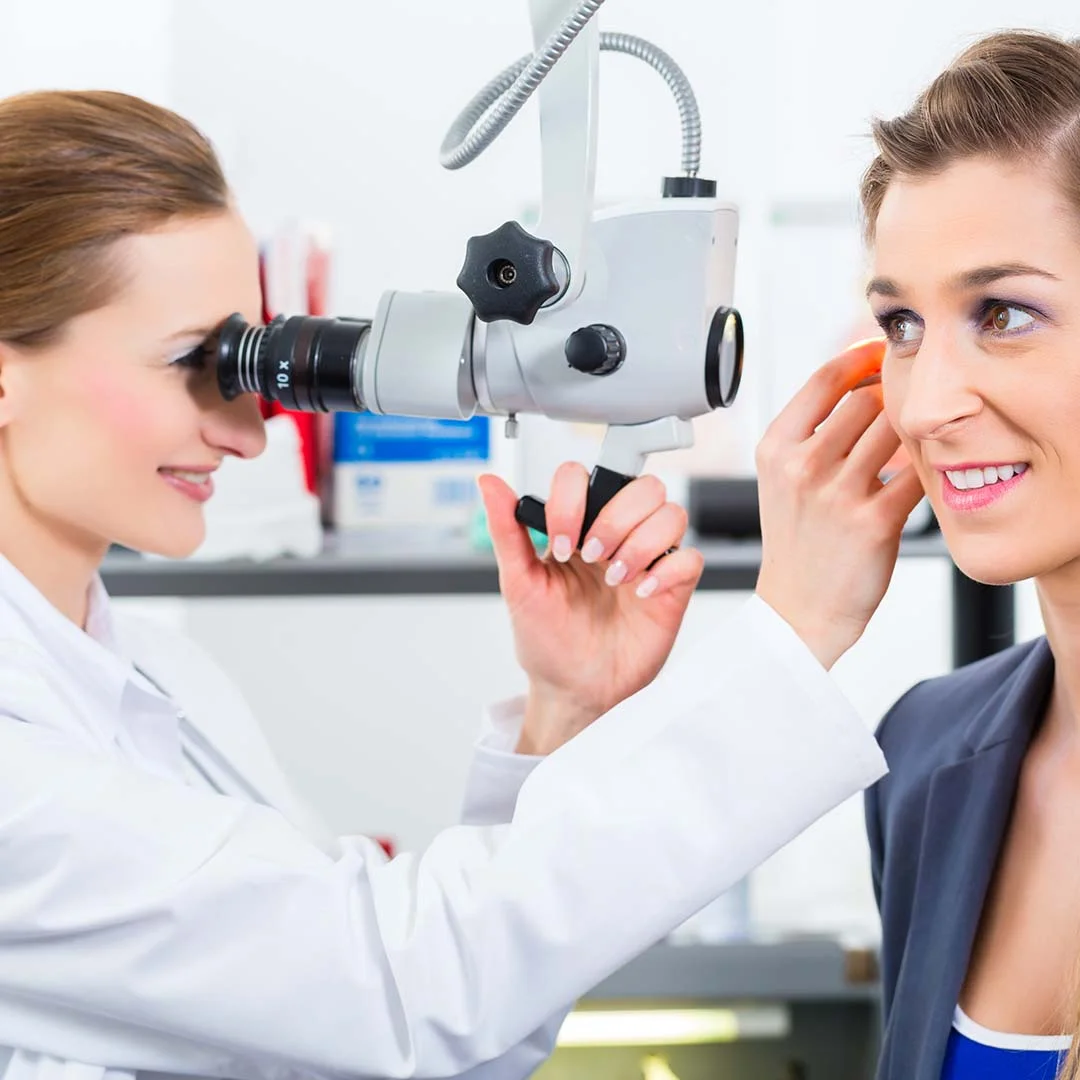 WOman getting checked out for ear disease