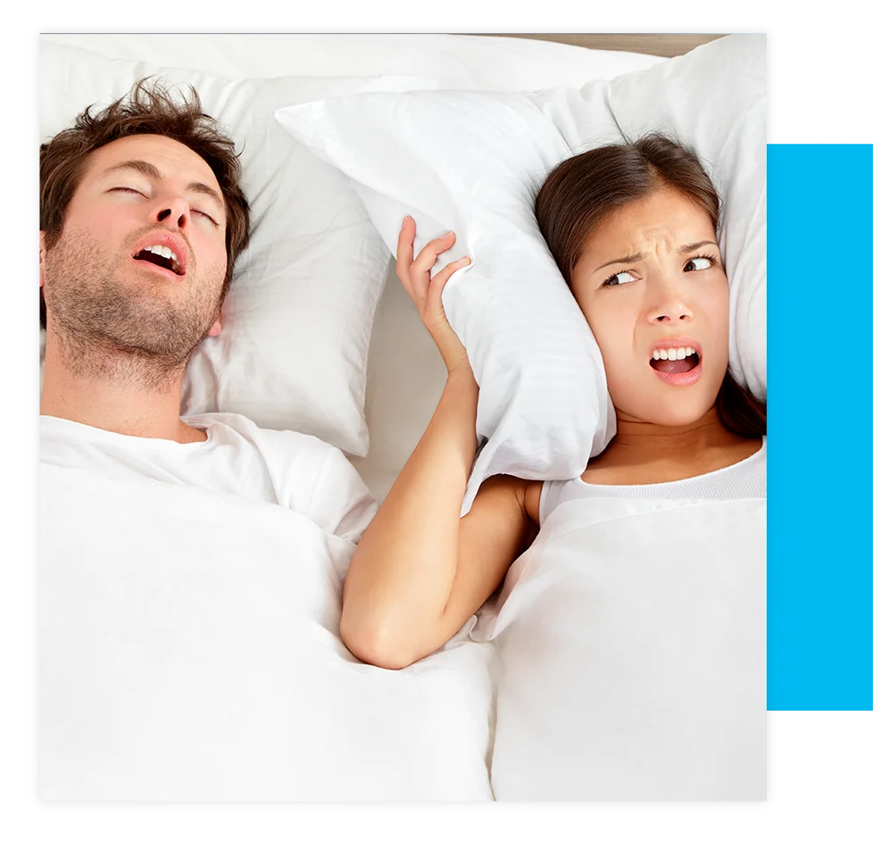 person suffering from sleep apnea partner snoring woman with pillow over her head