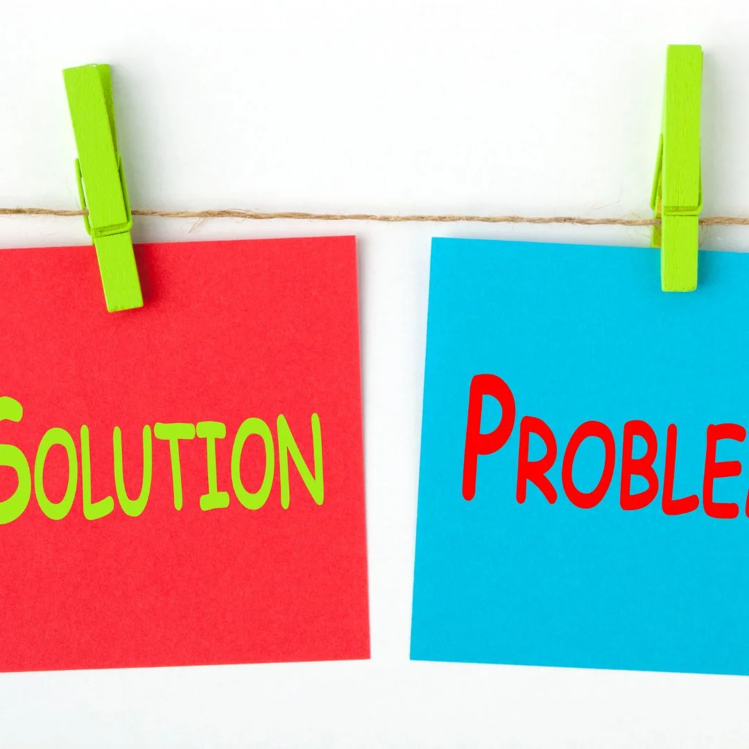 sticky notes saying problem and the other sticky note saying solution