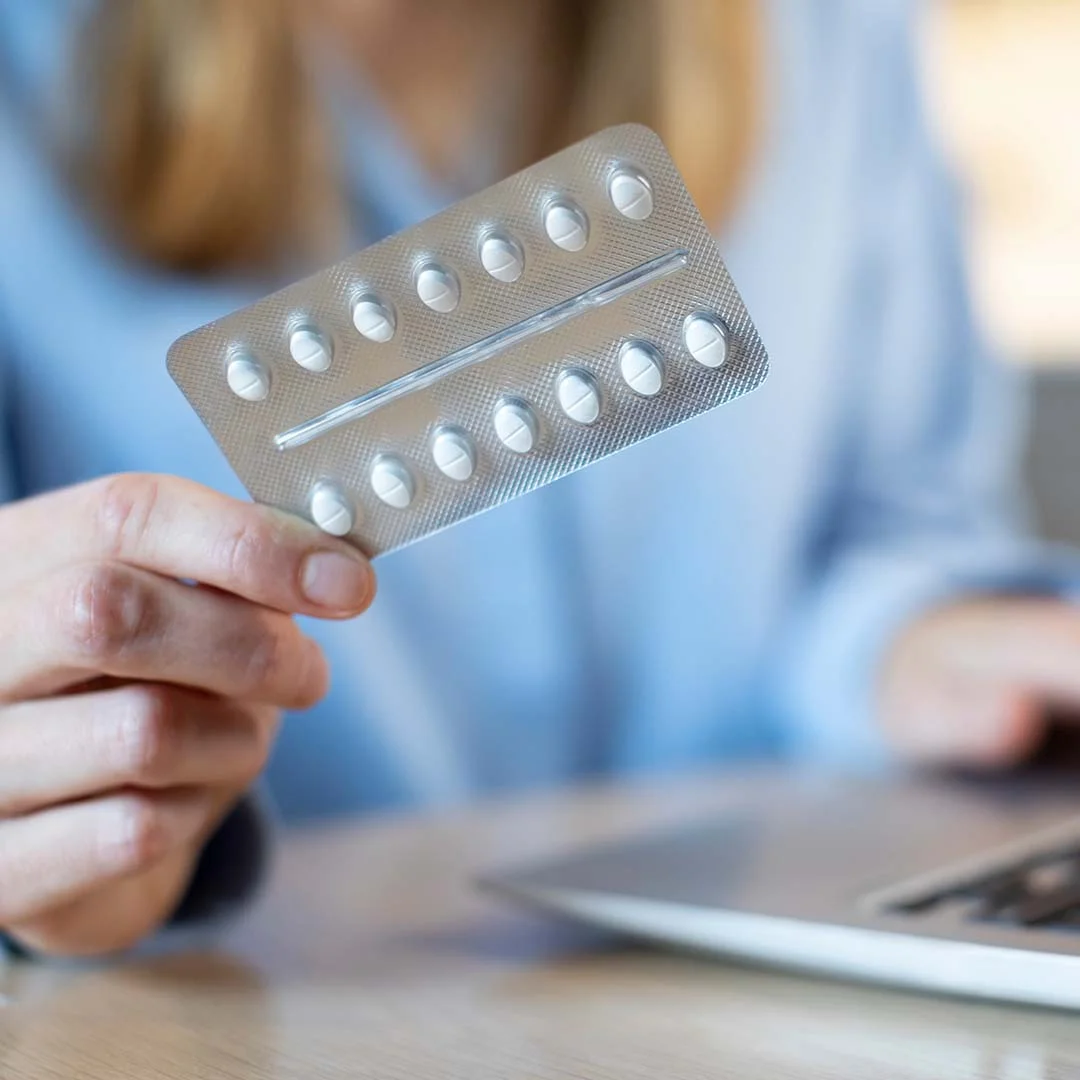 Woman holding medication