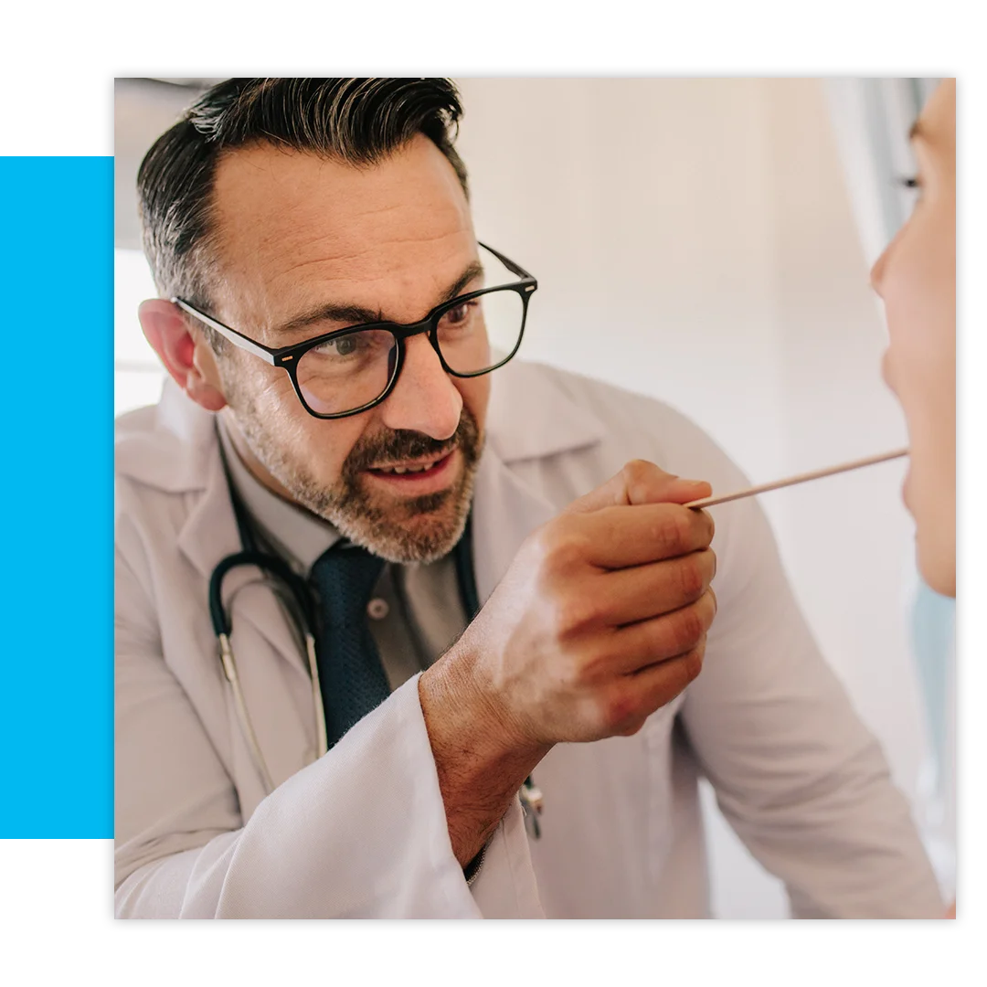 ENT doctor using tongue depressor