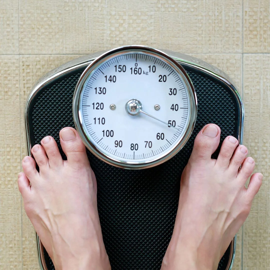 a person standing on a scale
