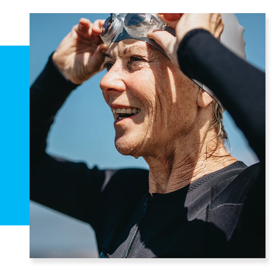 Older woman in swim cap and goggles