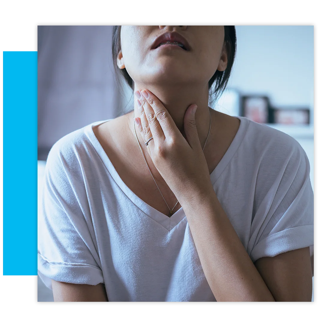 Woman touching throat