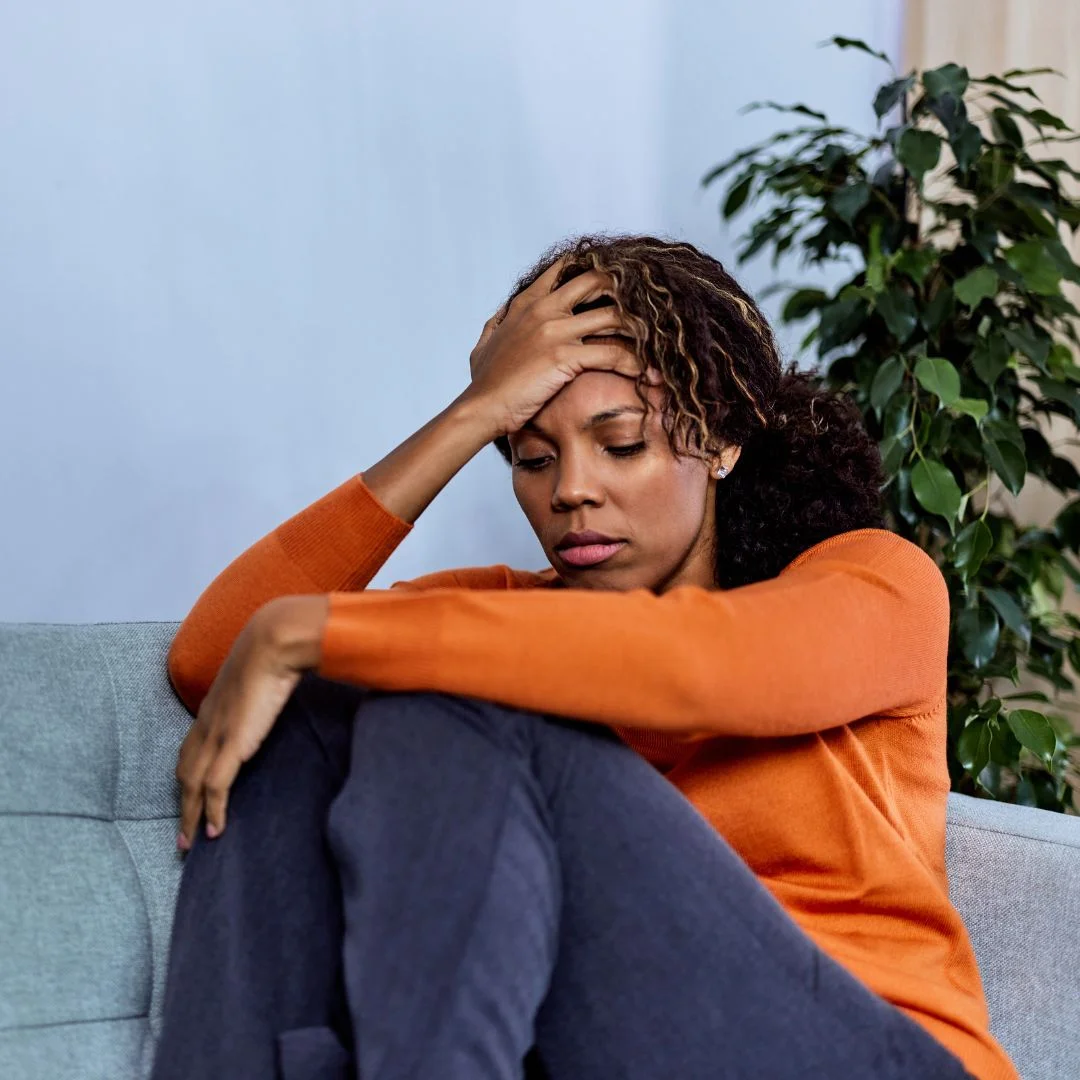a woman holding her head